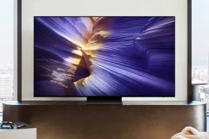 Samsung's S90F 4K TV on top of a stand.